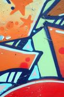 Street art. Abstract background image of a fragment of a colored graffiti painting in beige and orange tones photo