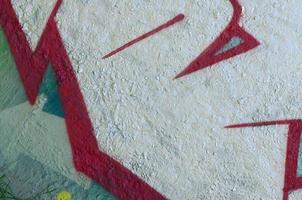 Street art. Abstract background image of a fragment of a colored graffiti painting in chrome and red tones photo