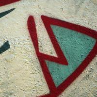 Street art. Abstract background image of a fragment of a colored graffiti painting in chrome and red tones photo