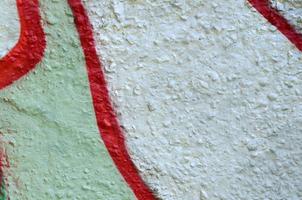 Street art. Abstract background image of a fragment of a colored graffiti painting in chrome and red tones photo