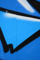 Street art. Abstract background image of a fragment of a colored graffiti painting in blue tones photo