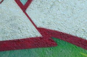 Street art. Abstract background image of a fragment of a colored graffiti painting in chrome and red tones photo