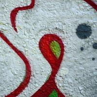 Street art. Abstract background image of a fragment of a colored graffiti painting in chrome and red tones photo