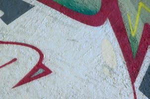 Street art. Abstract background image of a fragment of a colored graffiti painting in chrome and red tones photo