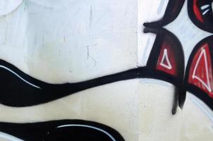 Street art. Abstract background image of a fragment of a colored graffiti painting in chrome and red tones photo