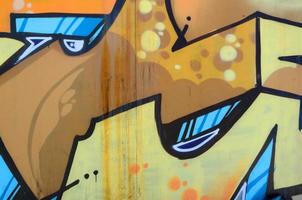 Street art. Abstract background image of a fragment of a colored graffiti painting in beige and orange tones photo