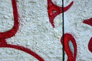 Street art. Abstract background image of a fragment of a colored graffiti painting in chrome and red tones photo