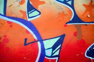 Street art. Abstract background image of a fragment of a colored graffiti painting in beige and orange tones photo
