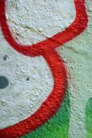 Street art. Abstract background image of a fragment of a colored graffiti painting in chrome and red tones photo