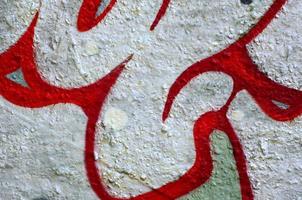 Street art. Abstract background image of a fragment of a colored graffiti painting in chrome and red tones photo