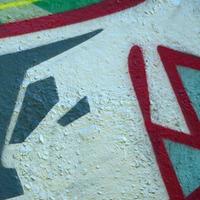 Street art. Abstract background image of a fragment of a colored graffiti painting in chrome and red tones photo