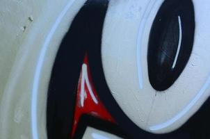 Street art. Abstract background image of a fragment of a colored graffiti painting in chrome and red tones photo