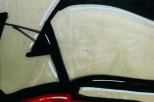 Street art. Abstract background image of a fragment of a colored graffiti painting in chrome and red tones photo