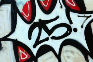 Street art. Abstract background image of a fragment of a colored graffiti painting in chrome and red tones photo