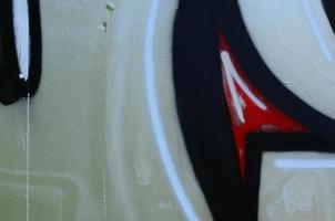 Street art. Abstract background image of a fragment of a colored graffiti painting in chrome and red tones photo