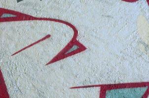 Street art. Abstract background image of a fragment of a colored graffiti painting in chrome and red tones photo