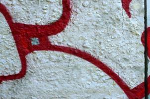 Street art. Abstract background image of a fragment of a colored graffiti painting in chrome and red tones photo