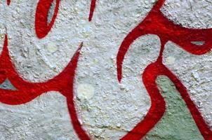 Street art. Abstract background image of a fragment of a colored graffiti painting in chrome and red tones photo