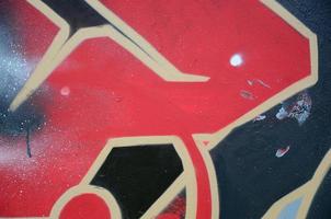 Street art. Abstract background image of a fragment of a colored graffiti painting in red tones photo