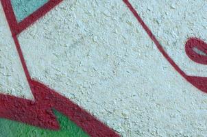 Street art. Abstract background image of a fragment of a colored graffiti painting in chrome and red tones photo