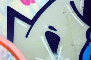 Street art. Abstract background image of a fragment of a colored graffiti painting in white and orange tones photo