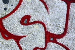 Street art. Abstract background image of a fragment of a colored graffiti painting in chrome and red tones photo