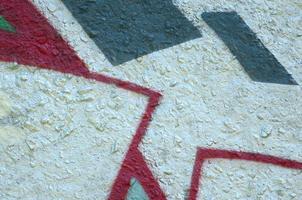 Street art. Abstract background image of a fragment of a colored graffiti painting in chrome and red tones photo