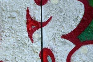 Street art. Abstract background image of a fragment of a colored graffiti painting in chrome and red tones photo