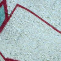 Street art. Abstract background image of a fragment of a colored graffiti painting in chrome and red tones photo