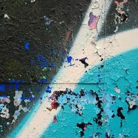 Street art. Abstract background image of a fragment of a colored graffiti painting in blue tones photo