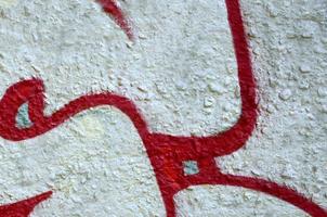 Street art. Abstract background image of a fragment of a colored graffiti painting in chrome and red tones photo