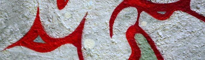 Street art. Abstract background image of a fragment of a colored graffiti painting in chrome and red tones photo