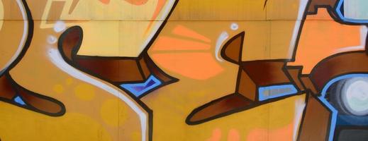 Street art. Abstract background image of a fragment of a colored graffiti painting in beige and orange tones photo