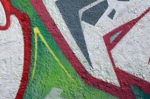 Street art. Abstract background image of a fragment of a colored graffiti painting in chrome and red tones photo