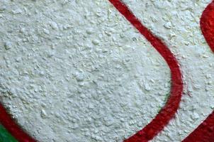 Street art. Abstract background image of a fragment of a colored graffiti painting in chrome and red tones photo