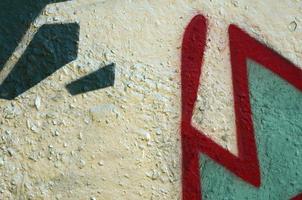 Street art. Abstract background image of a fragment of a colored graffiti painting in chrome and red tones photo