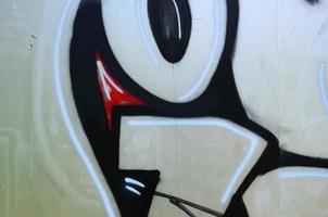 Street art. Abstract background image of a fragment of a colored graffiti painting in chrome and red tones photo