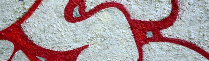 Street art. Abstract background image of a fragment of a colored graffiti painting in chrome and red tones photo