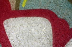 Street art. Abstract background image of a fragment of a colored graffiti painting in chrome and red tones photo