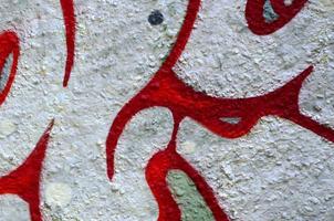 Street art. Abstract background image of a fragment of a colored graffiti painting in chrome and red tones photo