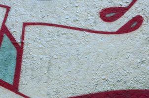 Street art. Abstract background image of a fragment of a colored graffiti painting in chrome and red tones photo