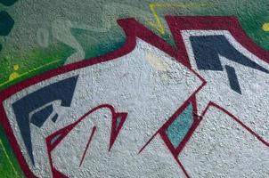 Street art. Abstract background image of a fragment of a colored graffiti painting in chrome and red tones photo