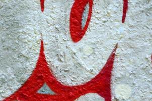 Street art. Abstract background image of a fragment of a colored graffiti painting in chrome and red tones photo