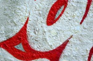 Street art. Abstract background image of a fragment of a colored graffiti painting in chrome and red tones photo