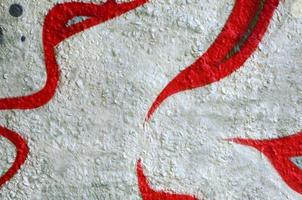 Street art. Abstract background image of a fragment of a colored graffiti painting in chrome and red tones photo