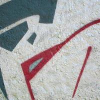 Street art. Abstract background image of a fragment of a colored graffiti painting in chrome and red tones photo