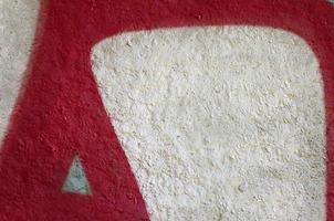 Street art. Abstract background image of a fragment of a colored graffiti painting in chrome and red tones photo