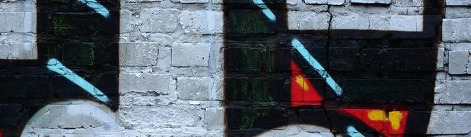 Street art. Abstract background image of a fragment of a colored graffiti painting in chrome and red tones photo