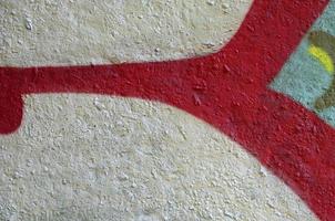 Street art. Abstract background image of a fragment of a colored graffiti painting in chrome and red tones photo