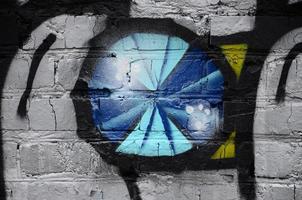 Street art. Abstract background image of a fragment of a colored graffiti painting in chrome and blue tones photo